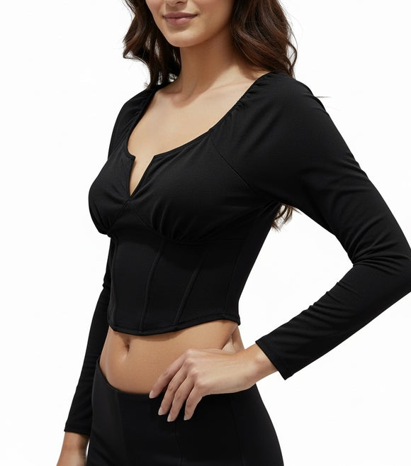 Blusa negra de ombliguera, manga larga y varillas